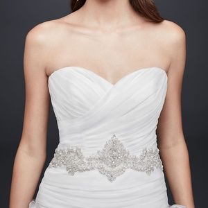 Ruffled skirt wedding gown with embellished waist
